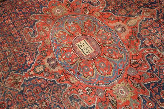 An antique Malayer carpet, dated 1905, 14ft 3in by 10ft 4in.